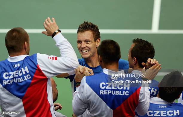 Tomas Berdych of Czech Republic is congratulated by his team mates after his five set win against Nicolas Almagro of Spain during day one of the...