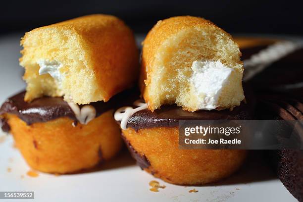 In this photo illustration, Hostess Brands Twinkies products are shown along with Golden Cup Cakes on November 16, 2012 in Miami, Florida. Hostess...
