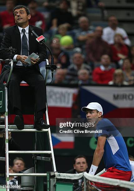 Tomas Berdych of Czech Republic makes a point to umpire Carlos Ramos during his match against Nicolas Almagro of Spain during day one of the final...