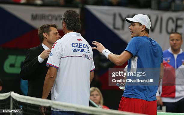 Tomas Berdych of Czech Republic and his team captain Jaroslav Navratil argue a point with the match referee during his match against Nicolas Almagro...