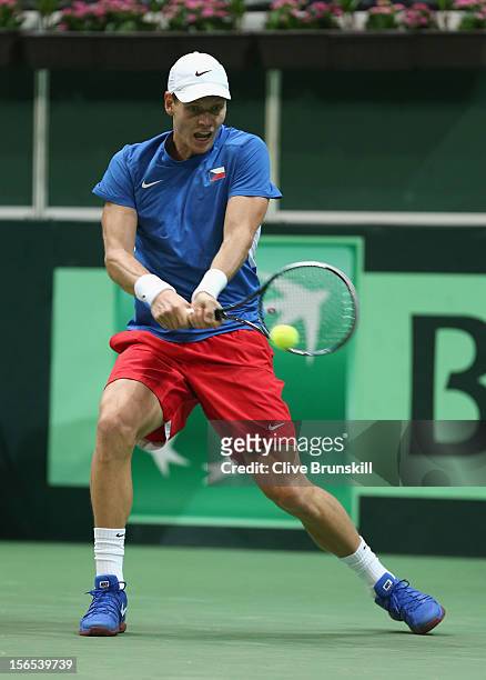 Tomas Berdych of Czech Republic plays a backhand against Nicolas Almagro of Spain during day one of the final Davis Cup match between Czech Republic...