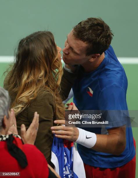 Tomas Berdych of Czech Republic kisses his girlfriend Ester Satorova after his five set win against Nicolas Almagro of Spain during day one of the...