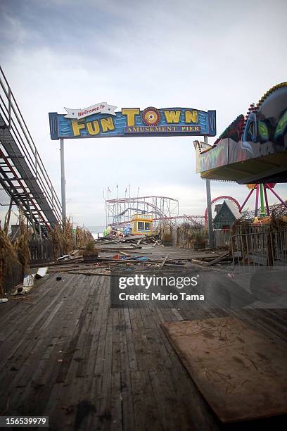 Sign stands above the heavily damaged Funtown Pier on November 16, 2012 in Seaside Heights, New Jersey. Two amusement piers and a number of roller...