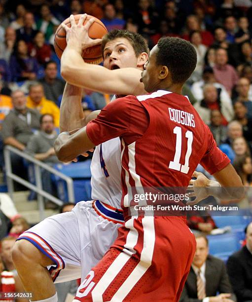 Texas-Arlington Mavericks guard Drew Charles drives as Oklahoma Sooners guard Isaiah Cousins defends during game action at the College Park Center in...