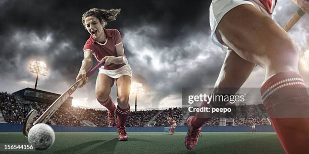 extreme close up field hockey action - hockey equipment stockfoto's en -beelden