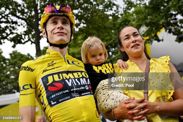Jonas Vingegaard of Denmark and Team Jumbo-Visma - Yellow Leader Jersey celebrates as final overall winner with his daughter Frida and wife Trine...