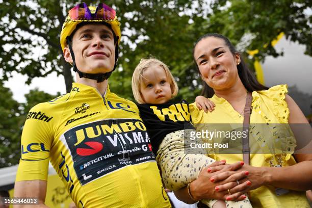Jonas Vingegaard of Denmark and Team Jumbo-Visma - Yellow Leader Jersey celebrates as final overall winner with his daughter Frida and wife Trine...