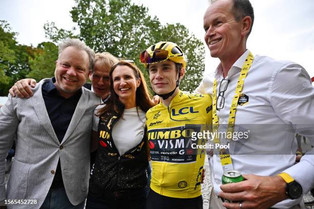 Jonas Vingegaard of Denmark and Team Jumbo-Visma - Yellow Leader Jersey celebrates as final overall winner with with his general team manager Richard...