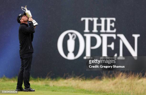Brian Harman of the United States kisses the Claret Jug whilst celebrating winning the The Open on the 18th green on Day Four of The 151st Open at...
