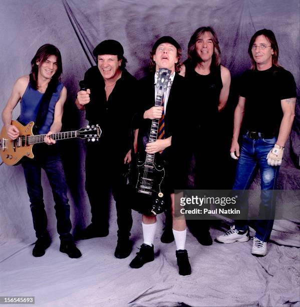Portrait of Australian rock group AC/DC backstage at the United Arena, Chicago, Illinois, April 8, 2001. Pictured are, from left, Malcolm Young,...