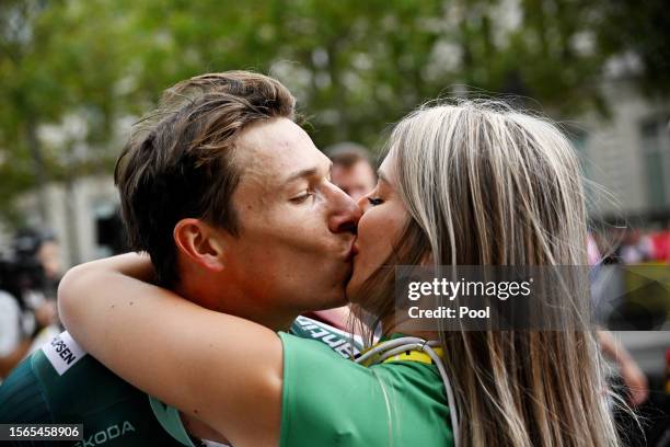 Jasper Philipsen of Belgium and Team Alpecin-Deceuninck - Green Points Jersey kisses his girlfriend Melanie Peetermans after the stage twenty-one of...