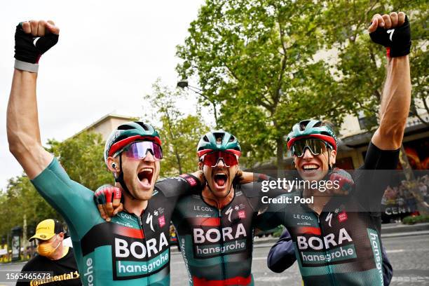 Stage winner Jordi Meeus of Belgium, Marco Haller of Austria and Danny Van Poppel of The Netherlands and Team BORA-Hansgrohe react after the stage...