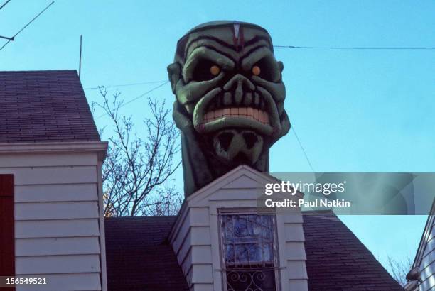 Iron Maiden's Eddie stage prop atop a home, Des Plaines, Illinois, early to mid 1980s. The prop was part of the stage show from heavy metal band Iron...