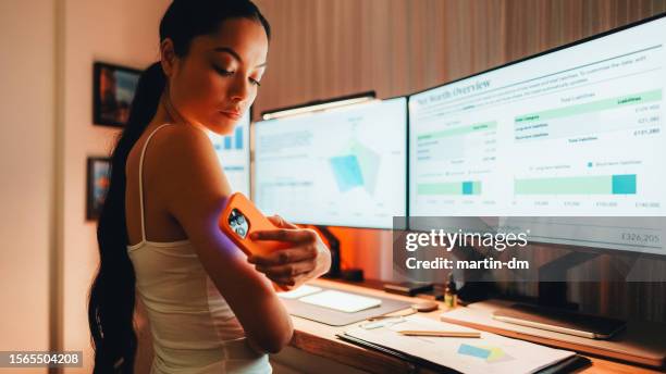 day in the life of woman with diabetes working from home - diabetes technology stock pictures, royalty-free photos & images