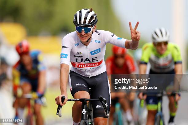 Tadej Pogacar of Slovenia and UAE Team Emirates - White Best Young Rider Jersey reacts after the stage twenty-one of the 110th Tour de France 2023 a...