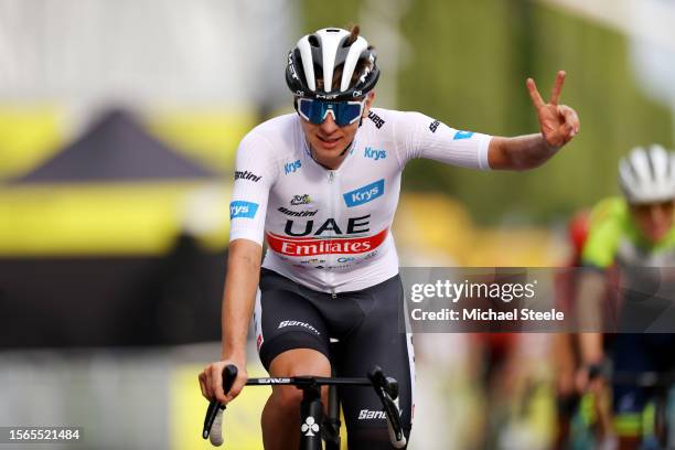 Tadej Pogacar of Slovenia and UAE Team Emirates - White Best Young Rider Jersey reacts after the stage twenty-one of the 110th Tour de France 2023 a...