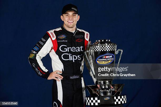 James Buescher, driver of the Great Clips Chevrolet, poses after winning the NASCAR Camping World Truck Series Championship after the Ford EcoBoost...