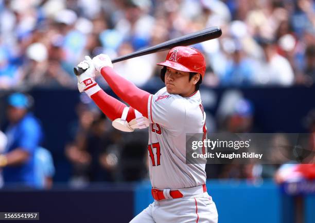 Shohei Ohtani of the Los Angeles Angels hits a single in the third inning against the Toronto Blue Jays at Rogers Centre on July 30, 2023 in Toronto,...