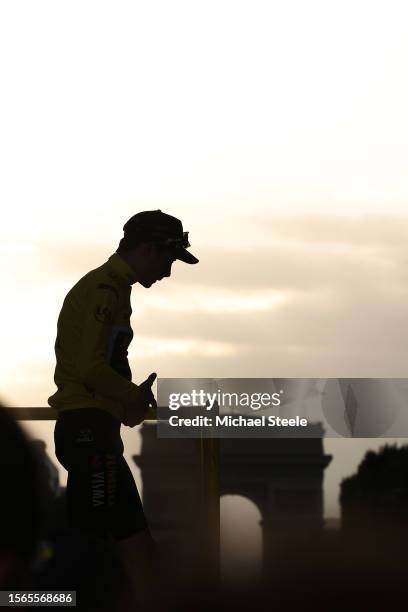 Silhouette of Jonas Vingegaard of Denmark and Team Jumbo-Visma - Yellow Leader Jersey celebrating at podium as final overall winner during the stage...