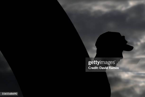 Silhouette of Jonas Vingegaard of Denmark and Team Jumbo-Visma - Yellow Leader Jersey celebrating at podium as final overall winner during the stage...