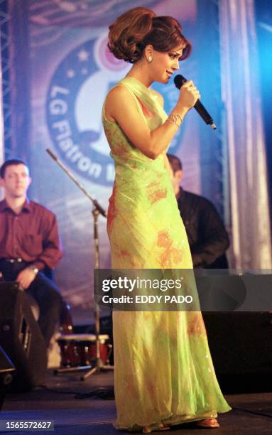 Lebanese pop singer Nawal al-Zoghbi sings in Dubai 01 March 2001, the first day of the Dubai Shopping Festival. Zoghbi is one of many Arab singers to...