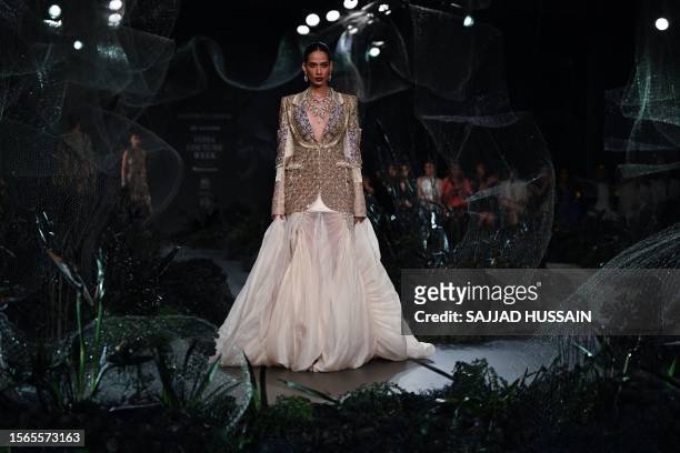 Model presents a creation by designer Anamika Khanna during the FDCI India Couture Week in New Delhi on July 30, 2023.