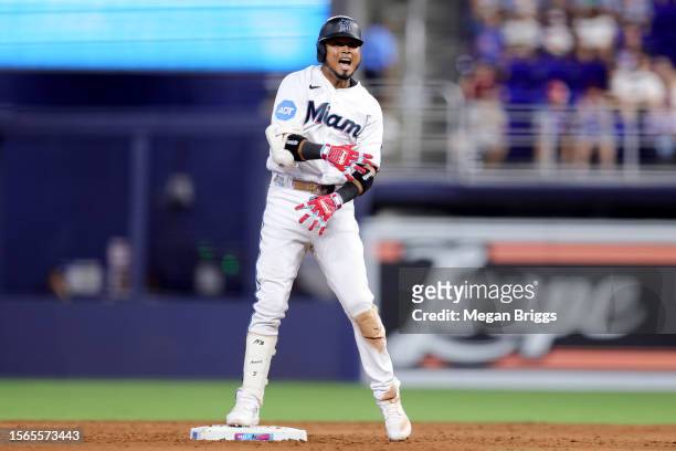 Luis Arraez of the Miami Marlins reacts after hitting an RBI double during the sixth inning against the Colorado Rockies at loanDepot park on July...
