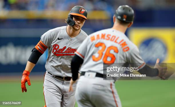 Gunnar Henderson of the Baltimore Orioles is congratulated after hitting a two run home run in the second inning during a game against the Tampa Bay...