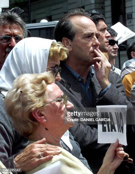 The singer Joan Manuel Serrat demonstrates against the terrorist group ETA in the Plaza de Mayo with another unidentified woman, in Buenos Aires,...