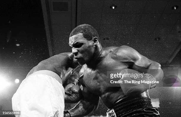 Mike Tyson lands a low blow to Jose Ribalta during a bout at Trump Plaza Hotel on August 17, 1986 in Atlantic City, New Jersey.Mike Tyson defeated...
