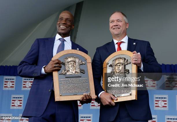 Inductees Fred McGriff and Scott Rolen pose for a photograph with their plaques during the Baseball Hall of Fame induction ceremony at Clark Sports...