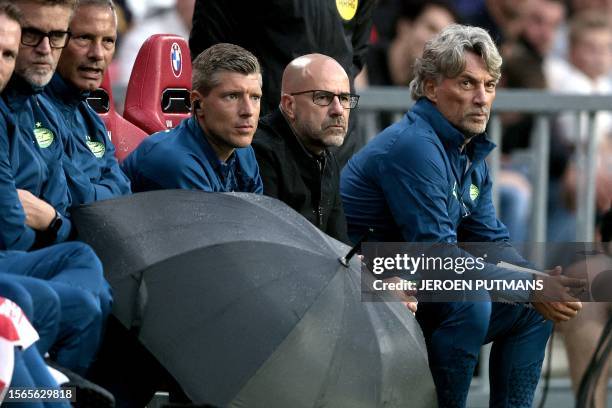 S Dutch coach Peter Bosz looks on during a friendly match between PSV Eindhoven and Nottingham Forest FC at Phillips stadium in Eindhoven, July 30,...