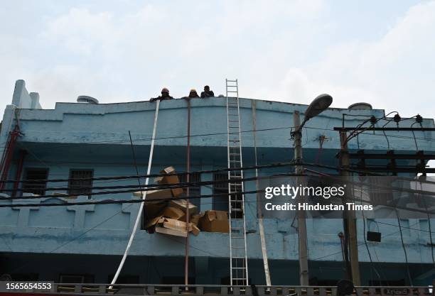 Firemen douse the fire that broke out at a footwear factory in west Delhi's Udyog Nagar near Peera Garhi Chowk in the morning, on July 30, 2023 in...