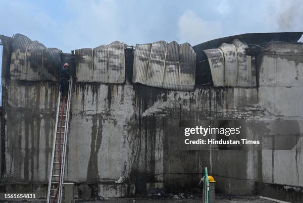 Firemen douse the fire that broke out at a footwear factory in west Delhi's Udyog Nagar near Peera Garhi Chowk in the morning, on July 30, 2023 in...