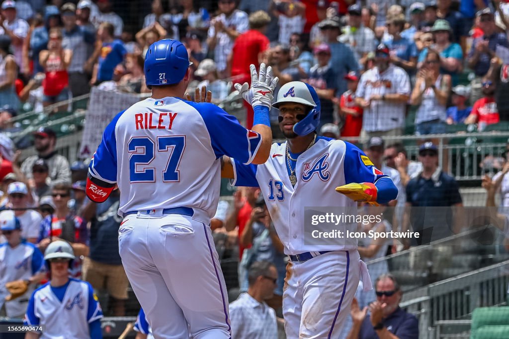 Austin Riley Third Base Atlanta Braves third baseman Austin Riley is greeted at home plate by ...