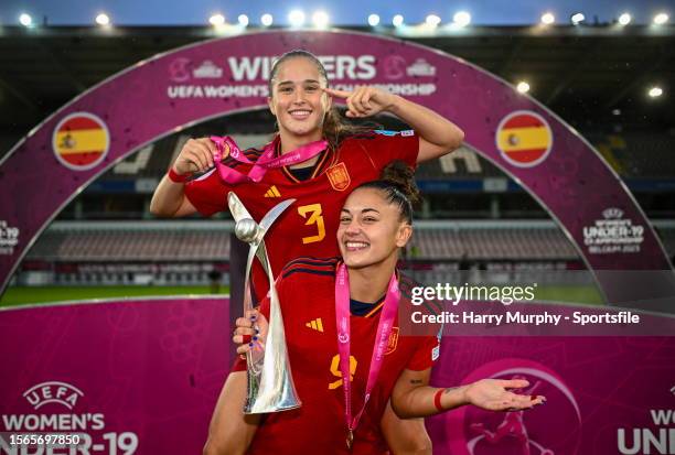 Andrea Medina, top, and Carla Camacho of Spain celebrate with the cup after the UEFA Women's European Under-19 Championship 2022/23 final match...