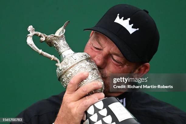 Alex Cejka of Germany kisses the trophy following his victory in a playoff during Day Four of The Senior Open Presented by Rolex at Royal Porthcawl...