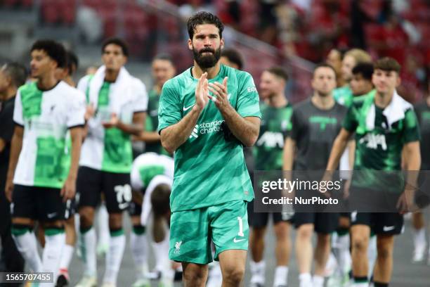 Allison Becker of Liverpool thanks the fans after the game during the pre-season friendly match between Liverpool and Leicester City at National...