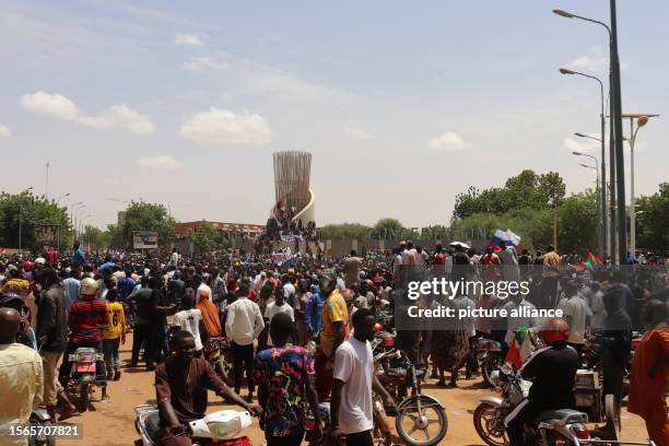 July 2023, Niger, Niamey: Demonstrators take part in a march in support of the coup plotters in the capital. After the coup in Niger, thousands...