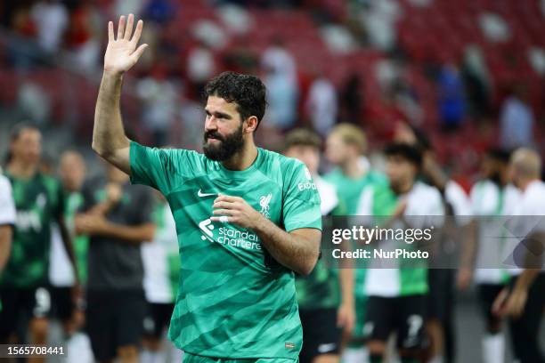 Allison Becker of Liverpool thanks the fans after the game during the pre-season friendly match between Liverpool and Leicester City at National...