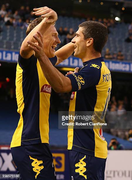Daniel McBreen of the Mariners celebrates scoring his second goal with team mate during the round seven A-League match between the Melbourne Victory...