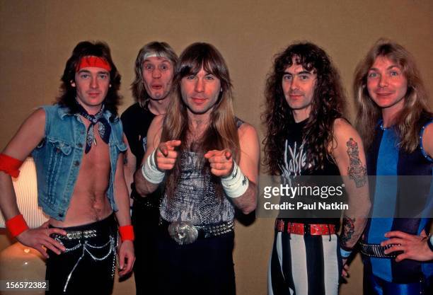 Portrait of British heavy metal band Iron Maiden backstage at the Poplar Creek Music Theater in Hoffman Estates during their World Slavery Tour,...