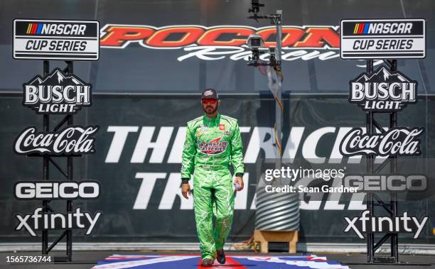 Martin Truex Jr., driver of the Interstate Batteries Toyota, walks out during driver intros prior to the NASCAR Cup Series HighPoint.com 400 at...