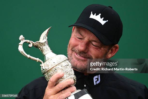 Alex Cejka of Germany holds the trophy following his victory in a playoff during Day Four of The Senior Open Presented by Rolex at Royal Porthcawl...