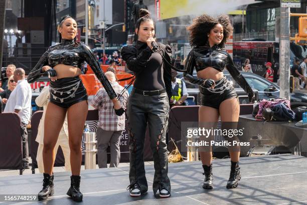 Singer Enisa Nikaj performs before Governor Kathy Hochul announcement of the Music Under New York Riders Choice Award Ceremony on Times Square. The...