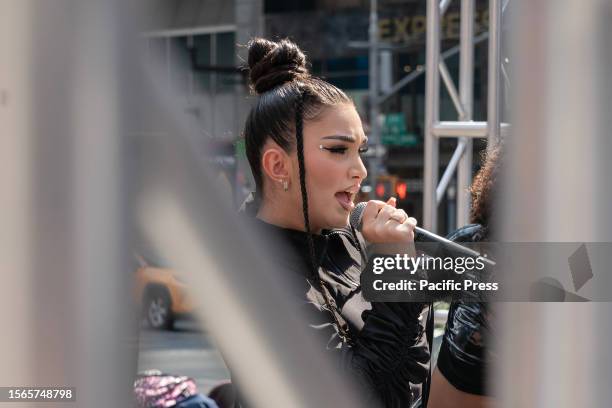 Singer Enisa Nikaj performs before Governor Kathy Hochul announcement of the Music Under New York Riders Choice Award Ceremony on Times Square. The...