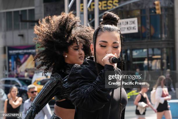 Singer Enisa Nikaj performs before Governor Kathy Hochul announcement of the Music Under New York Riders Choice Award Ceremony on Times Square. The...