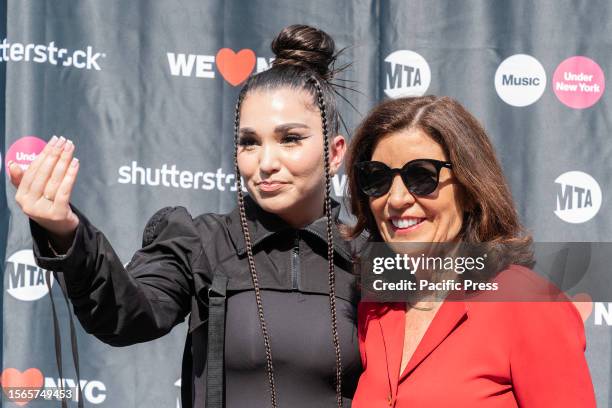 Singer Enisa Nikaj poses with Governor Kathy Hochul at announcement of the Music Under New York Riders Choice Award Ceremony on Times Square. The...