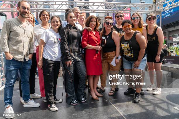 Singer Enisa Nikaj, Camille Hackney, Brass Queens, Janno Lieber pose with Governor Kathy Hochul at announcement of the Music Under New York Riders...