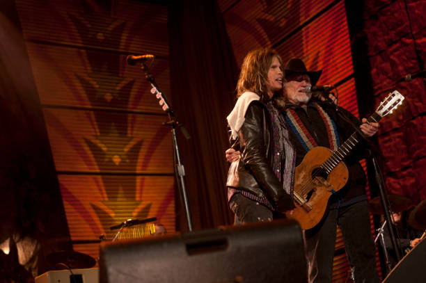American musicians Steven Tyler and Willie Nelson perform at the Farm Aid 25th Anniversary Concert at Miller Park, Milwaukee, Wisconsin, October 2,...